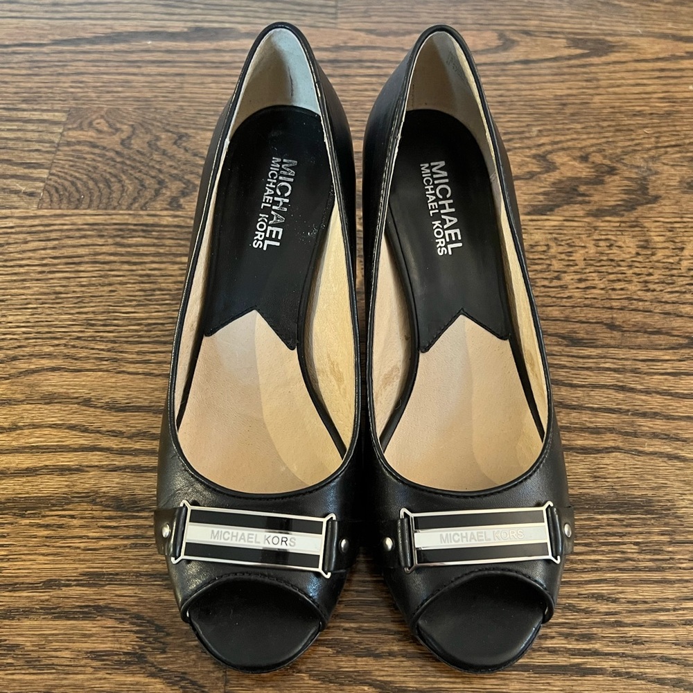 Size 6.5 Michael Kors pumps with 2.5 inch heel.